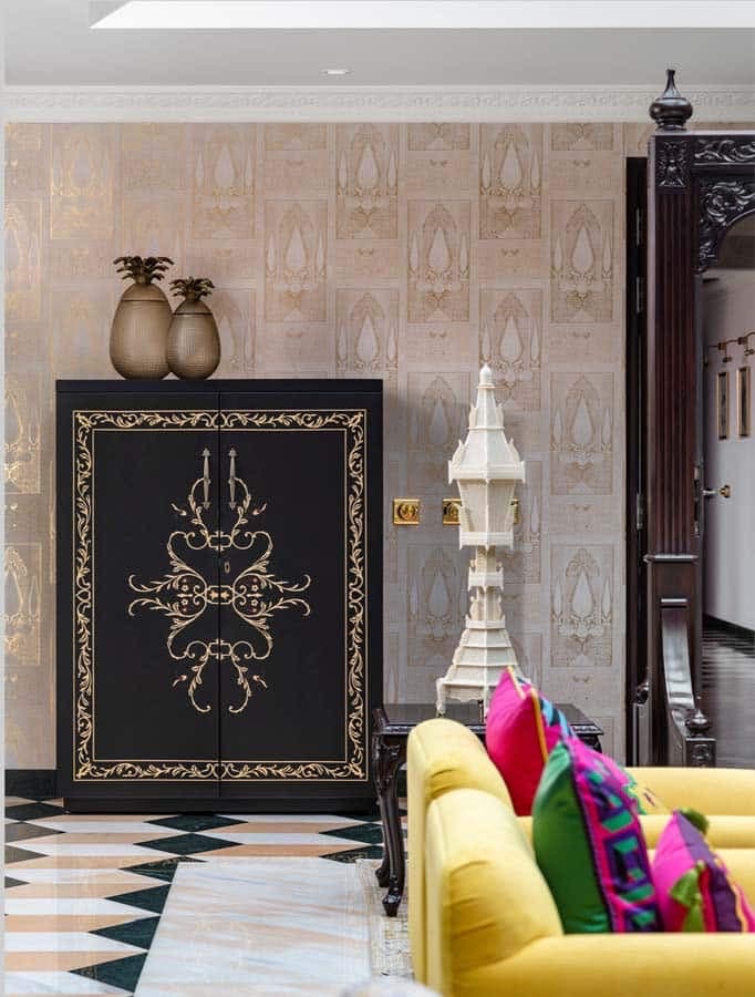 Ornate cabinet and colourful seating in a heritage interior — hospitality photography by Imagesque, Dubai