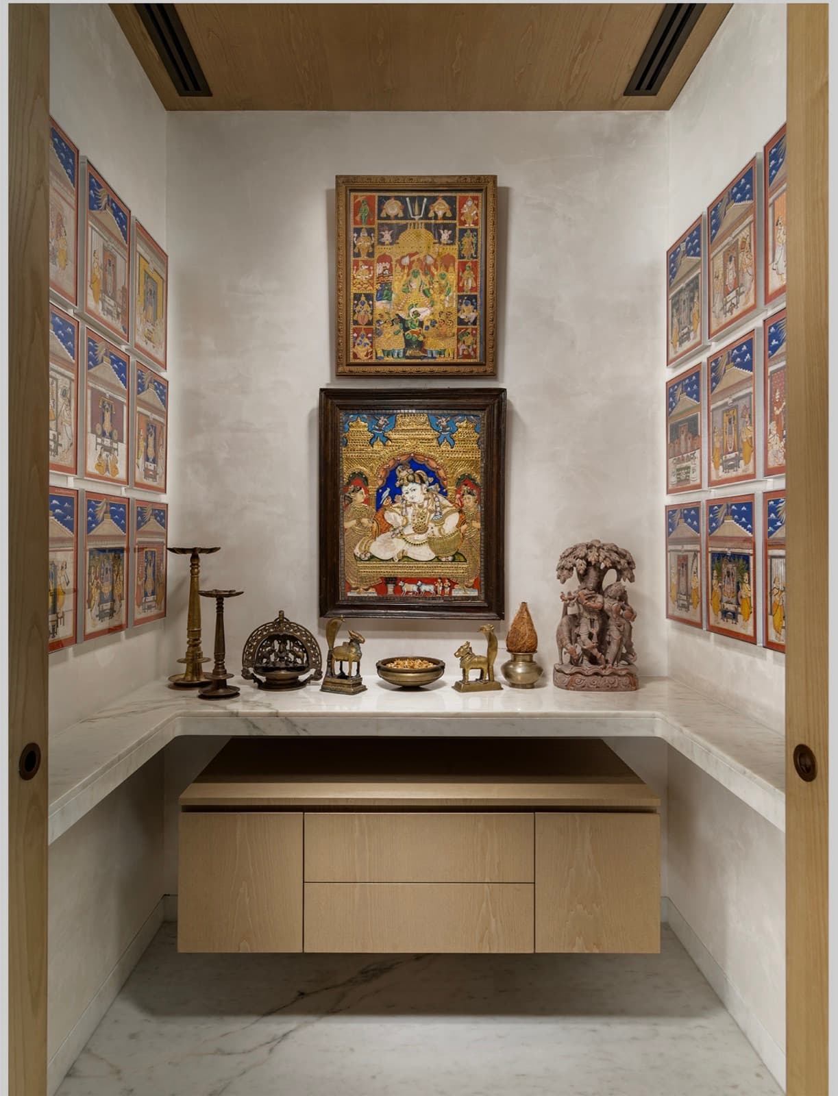 Detail of a carved shrine and artwork in a luxury residence — hospitality photography by Imagesque, Dubai