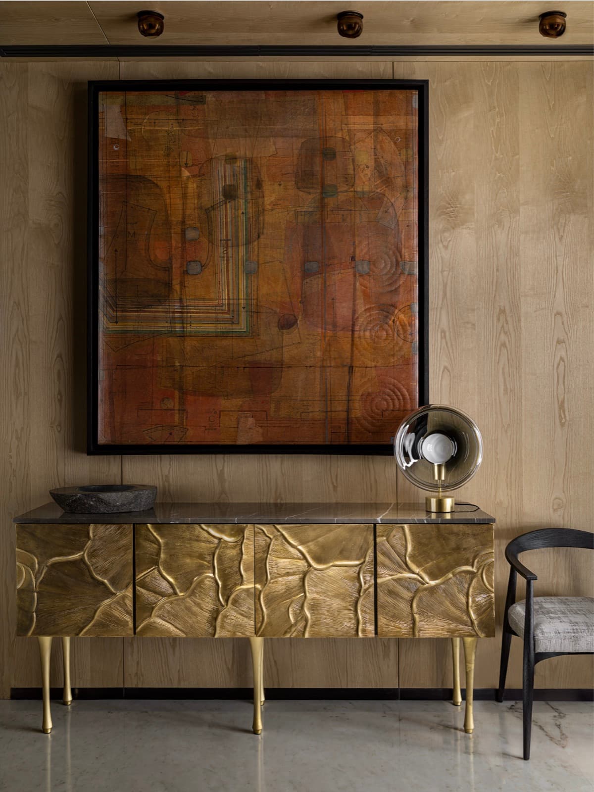 Gallery wall and brass sideboard in a luxury interior — hospitality photography by Imagesque, Dubai